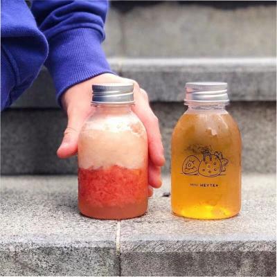 China Botellas de jugo de plástico de 250 ml herméticas vacías con tapa de PET redonda en venta