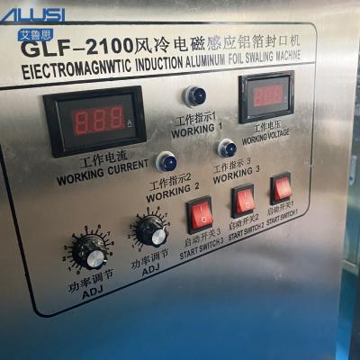 China Máquina plástica da selagem da folha de alumínio de tampão de garrafa do petisco contínuo automático da indução eletromagnética à venda
