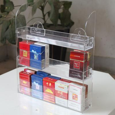 China Estante de visualización de datos multicámara de doble capa de caja de cigarrillos acrílicos Estante publicitario de archivos en venta