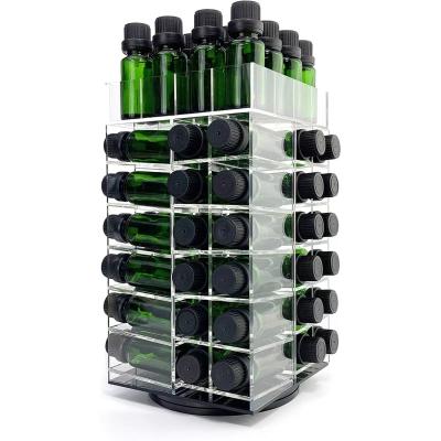 China Rotating Acrylic Display Stand Case Counter Top Clear Essential Oil Bottles Storage Rack For 64 Bottles for sale