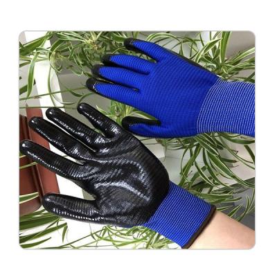 China Seamless Blue Polyester Knit Black Nitrile Gloves for sale