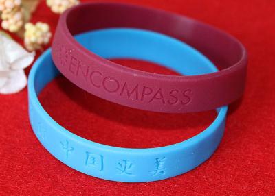 China Lettering Debossed Silicone Wristbands , Rubber Promotional Bracelets Smooth Edge for sale