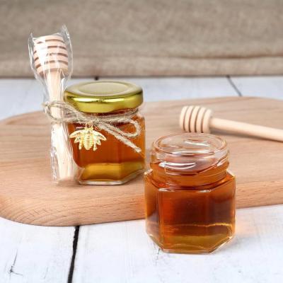 China Factory 45ml 1.5oz hexagonal clear mini glass jars for honey honey jar packaging honey jar with dipper and bee for gift for sale