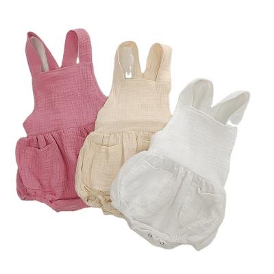 China Summer Cotton Muslin Baby Clothes Sleeveless Romper Strap Pants With Pocket Solid Baby Bodysuit for sale