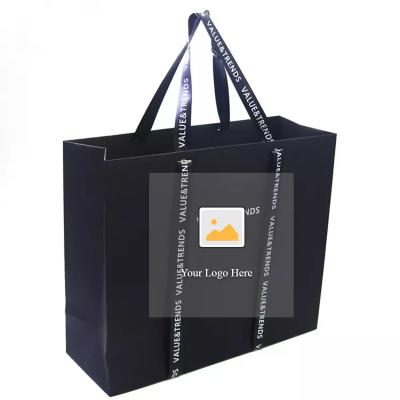 China OEM 20x25x10cm Personalized Paper Garment Bags With Satin Ribbon for sale