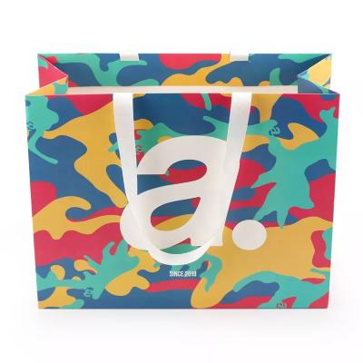 China Custom Graffiti Boutique Clothing Recycled Paper Bags With Handles for sale