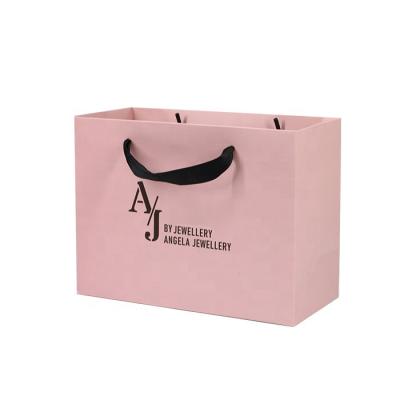 China Glossy Lamination Shoes Clothing Paper Bags 250gam Coated Pink Kraft Bags for sale