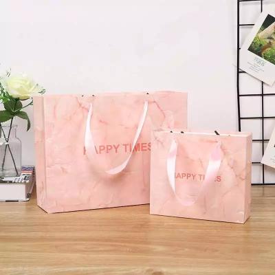 China Customized Logo 180gsm-500gsm Boutique Paper Bag With Handles for sale