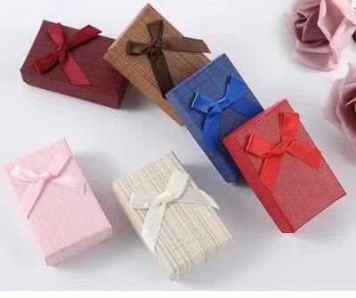 China Luxury Jewelry Embossing Cardboard Gift Packaging Box With Ribbon for sale