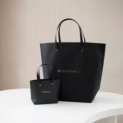 China ODM 180gsm To 250gsm Present Paper Bags Clothing Wedding Favor Bags With Handles for sale