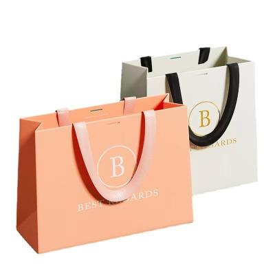 China ODM Grapefruit Color Paper Garment Bags Custom Printed Paper Take Out Bags for sale