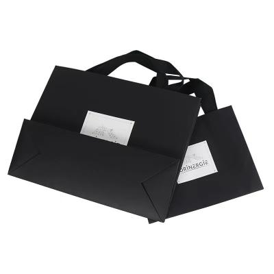 China OEM Black White Apparel Paper Bag Clothing Marble Paper Gift Bags for sale
