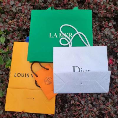 China OEM Logo Green Cosmetic Paper Bags for sale