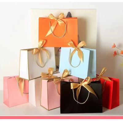 China Ribbon Handle Cosmetic Paper Bags for sale
