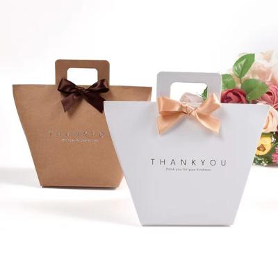 China Custom Logo White Kraft Present Paper Bags 9.5*9*12cm French Gift Bag With Ribbon for sale