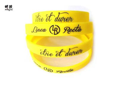 China Round Shape Custom Gel Bracelets , Yellow Debossed Silicone Wristband Bracelet for sale