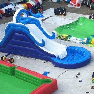 China Blue Wave Inflatable water slides climbing wall With Pool Cartoon Theme for sale