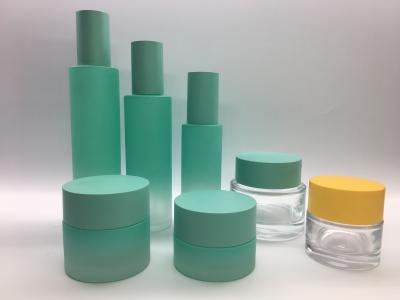 China Botella de cristal redonda recta de la bomba de la loción y tarro poner crema para el empaquetado del cuidado de la piel en venta