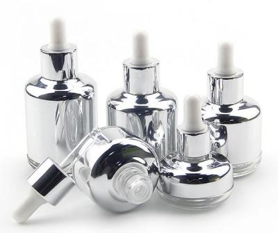 China Reusing 20ml 60ml Glass Essential Oil Bottles for Skincare Packaging OEM with different dropper shape for sale