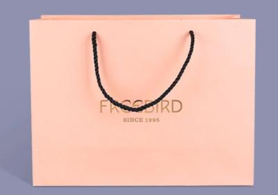 China Delicate Bespoke Printed Paper Bags , Pink Paper Carrier Bags Accurate 4C Printing for sale