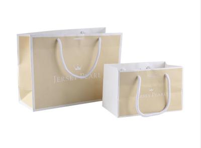 China Customized Size Paper Shopping Bags With Silk Ribbon / Circle Tube Handle for sale