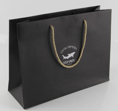 China Black Color Printed Kraft Paper Bags High Elasticity With Nylon Rope Handle for sale