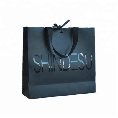 China Customized Logo Printed Paper Merchandise Bags Luxury High Bearing Capacity for sale