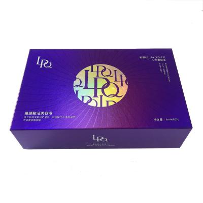 China Custom Cardboard Purple Magnetic Gift Box For Mask Skincare Bottles for sale