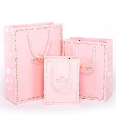China Litho Printing Pink Paper Gift Bags For Kids Birthday Holiday Presents for sale