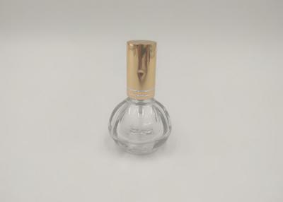 China Botella de cristal del espray del perfume de oro de la bomba redonda con la impresión modificada para requisitos particulares de los logotipos en venta
