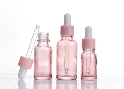 China botella de cristal translúcida del dropper del rosa de 15ml 30ml para el aceite esencial modificado para requisitos particulares en venta