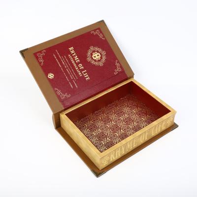 China Embossing Wooden Book Shaped Gift Box Leather Wrapping Surface Round Spine 3D Metal Logo for sale