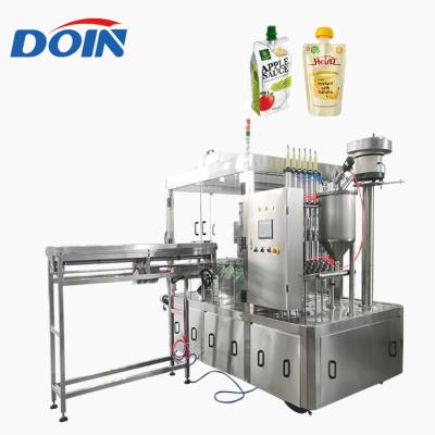 China Food Doin supply yogurt spout pouch screw packing machine factory/soy milk doypack spout pouch filling capping machine à venda
