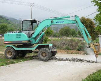 China Four Wheel Drive Wheeled Excavator With Breaker Hammer Light Blue for sale