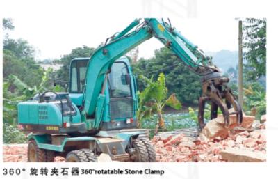 China Mini excavador rodado cuatro pies con la abrazadera de piedra rotativa de 360 grados en venta