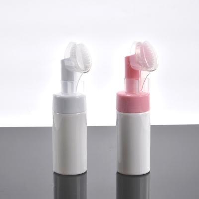 China White Empty Foaming Face Wash Bottle With Brush Silicone Cleansing Massage Facial Pump Bottle for sale