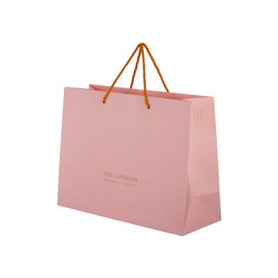 China Multipurpose Pink Custom Paper Shopping Bags With Plastic Clip Handle for sale