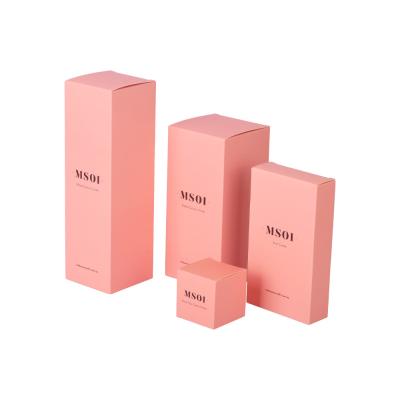 China Embalaje de caja de papel cosmético plegable rosa Aceite esencial para el cuidado de la piel en venta