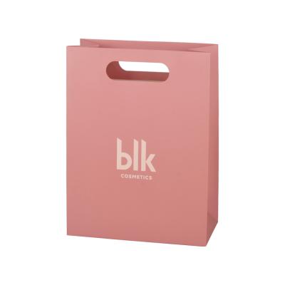 China Bio - bolsas de papel rosa biodegradables ropa de embalaje con mango de corte a presión en venta