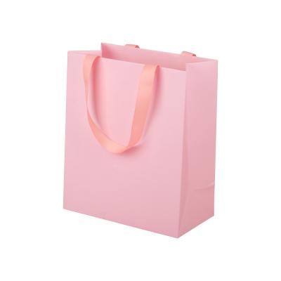 中国 Pink Shopping Paper Bags Packaging Gift With Grosgrain Ribbon Handle 販売のため