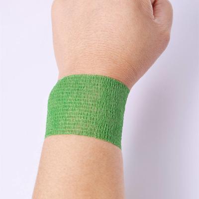 China SJ Custom Logo Durable Wrap Tube Fittings Self-adhesive Tape Sticky Elastic Non Woven Tattoo Sports Bandage en venta