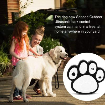 China Dog Paw Shape Ultrasonic Dog Bark Control Indoor Outdoor Deterrent Control Device for sale