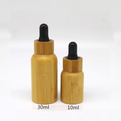 China Wooden Lid Cosmetic Dropper Bottles Hot Stamping Glass Perfume Dropper for sale