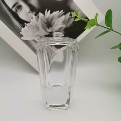 China Flat Shoulder Clear Glass Perfume Spray Bottles 30ml 50ml 100ml for sale