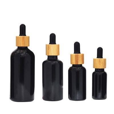 China 1oz 2oz Matte Black Glass Dropper Bottles con el ODM del OEM de la pipeta en venta