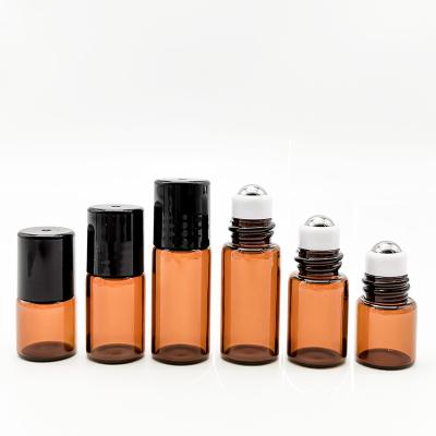 China Plastic Cap 10ml Amber Glass Roller Bottles For Essential Oils Refillable for sale