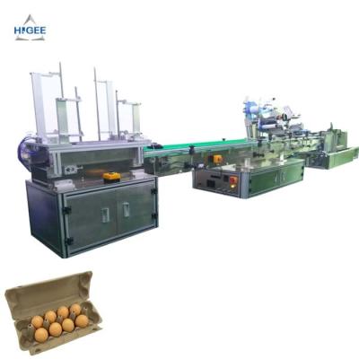 China Disposable 6 egg tray sticker labeling machine eggs tray carton paper label applicator machine with top side for sale