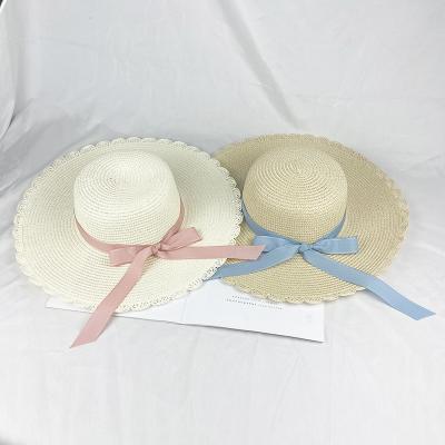 China Summer Big Brim Lace Sunscreen Beach Straw Hat With Bow For Women en venta