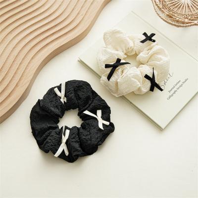 China Black And White Contrast Color Bow Fabric Elegant Hair Rope For Female en venta