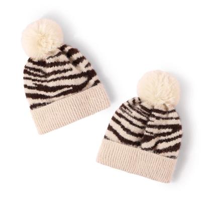 China Trendy Striped Pom Pom Hat Knitted Hat For Women And Men for sale